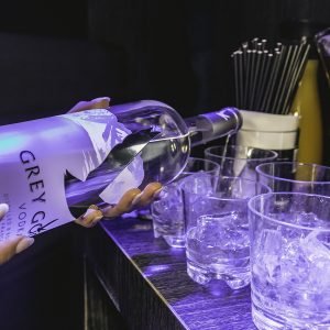 Vodka pouring in glasses.