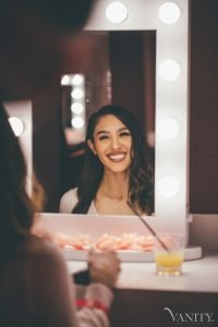 Smiling Girl in Mirror